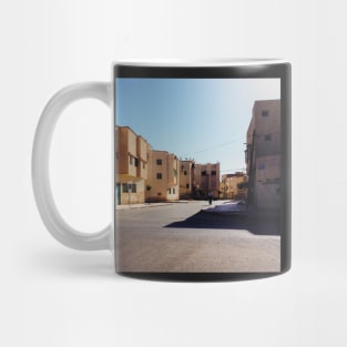 Man Riding Bicycle Through Moroccan Suburb Mug